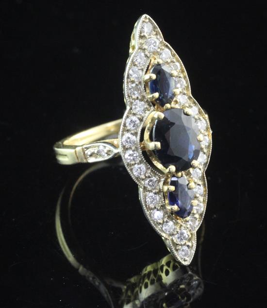 A French 18ct gold, sapphire and diamond up-finger ring, size K.